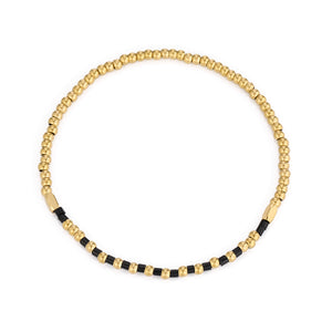 Armband zwarte kralen stretch goud