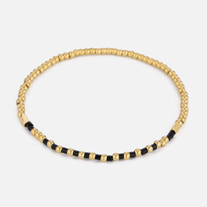 Armband zwarte kralen stretch goud