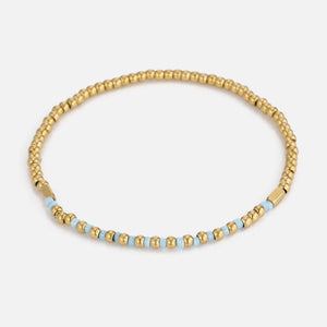 Armband turquoise kralen stretch goud