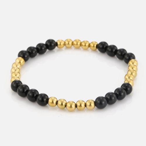 Armband bolletjes en zwarte steentjes stretch