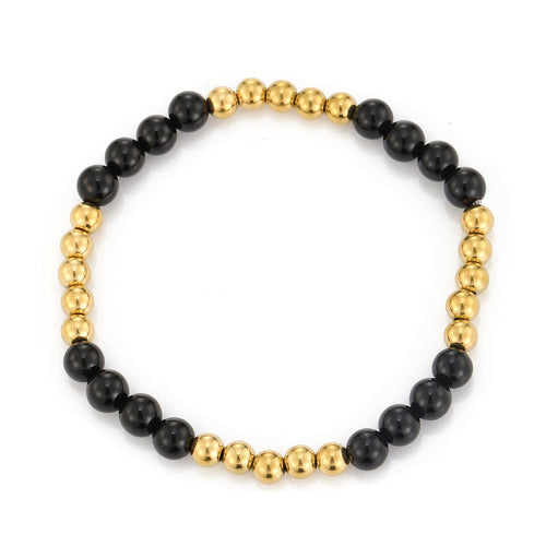 Armband bolletjes en zwarte steentjes stretch