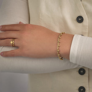Armband gedraaid bollen goud