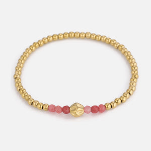 Armband rode kralen stretch goud