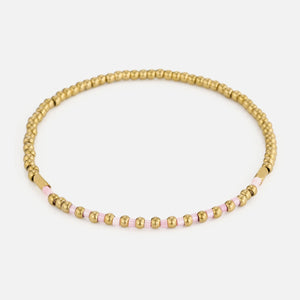 Armband roze kralen stretch goud