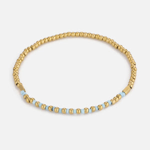 Armband turquoise kralen stretch goud