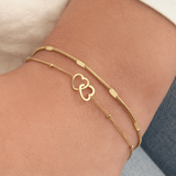Armband verbonden hartjes goud