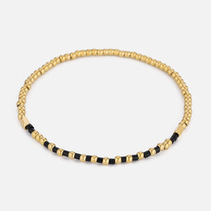 Armband zwarte kralen stretch goud