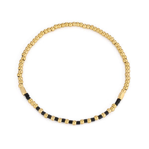 Armband zwarte kralen stretch goud