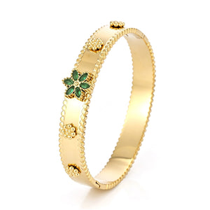 Flower bangle with green stones
