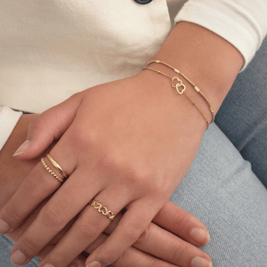 Dunne motief armband goud