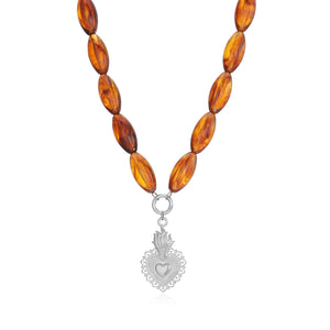 Long beaded necklace with heart pendant