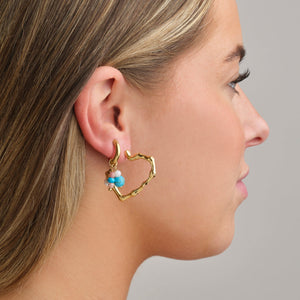 Oorbellen blauw gekleurde kralen goud