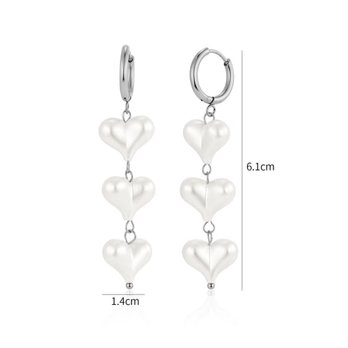 Dangling heart pearl earrings