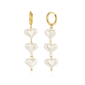 Oorbellen hangende parel hartjes goud