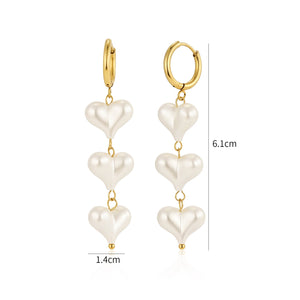 Oorbellen hangende parel hartjes goud