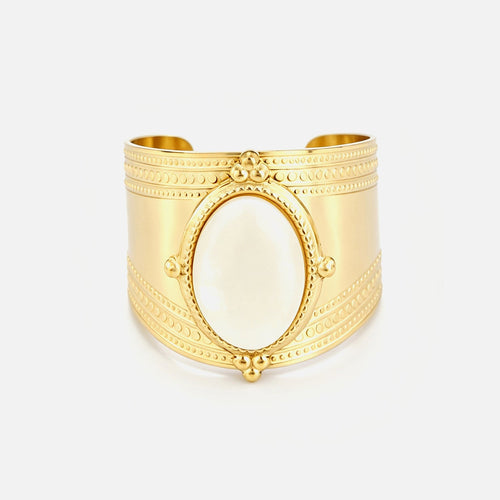 Wide band ring with white stone