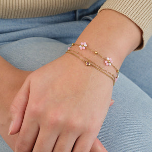 Tweelaags armband met roze steentje goud
